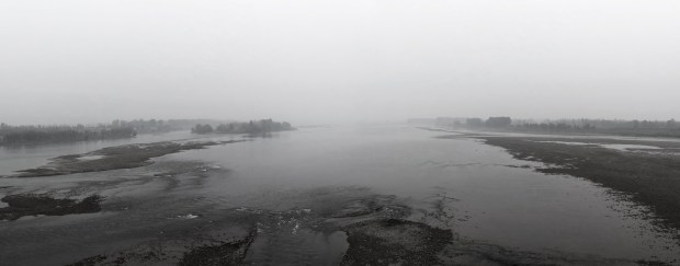 Heavy smog hanging over the Yellow River. Heading for Wushi, Henan, China.